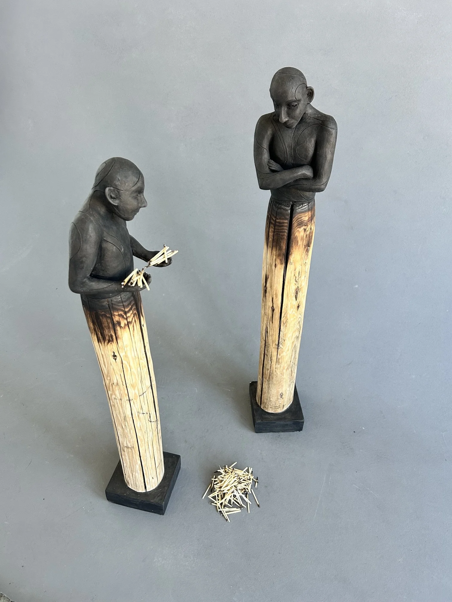 The Matchstick Brothers
2026
Ceramic stained with Sumi ink, Recycled Wood, Concrete, and Burnt Matchsticks
H50" x W7" x D6"