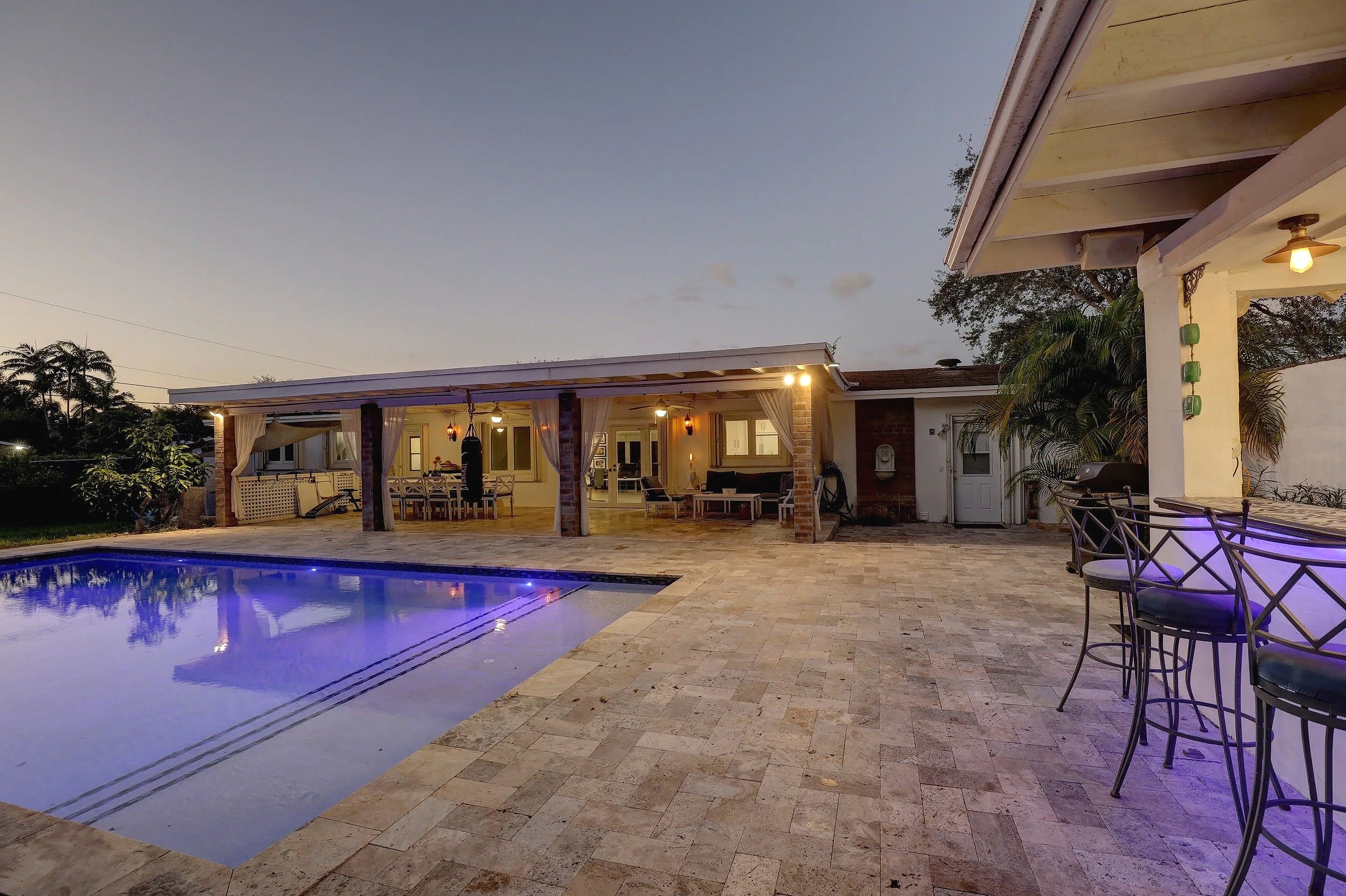 Miami-Continental Park area golden house Mediterranean style backyard with pool