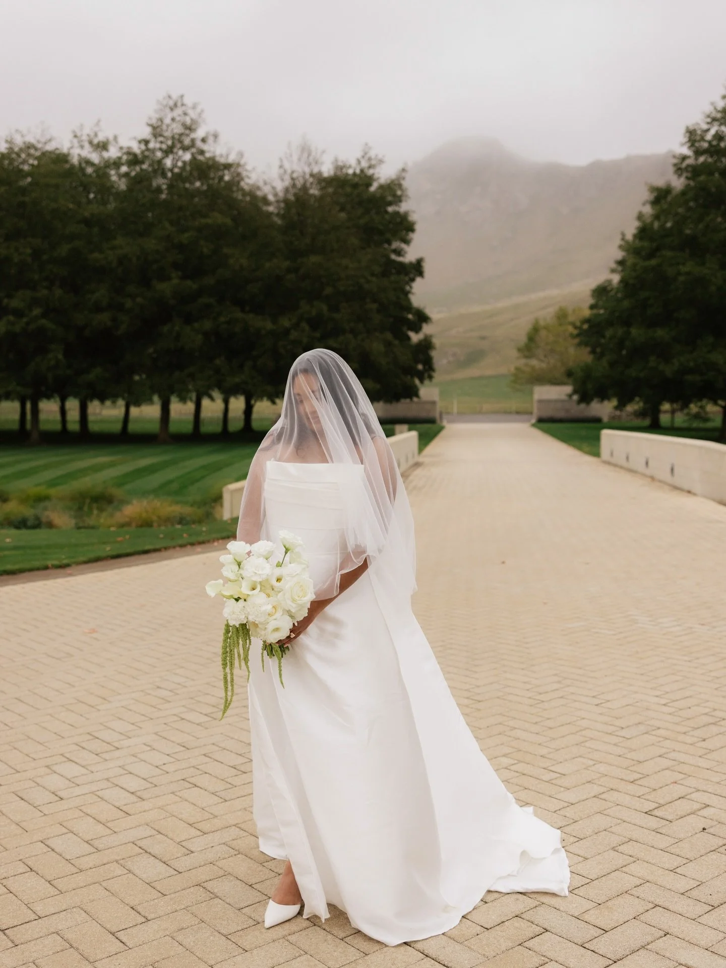 The Bouquet Recipe ~ New Zealand roses, calla lilies, lisianthus, amaranthus &amp; fluffy carnations held by the gorgeous bride, Annika 🤍 

Photographer @rachelburt.weddings 
Venue @craggyrange