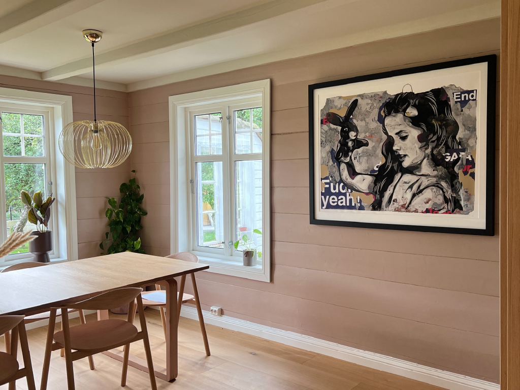 A Framed hand‑embellished version of 'Medeina' in situ.