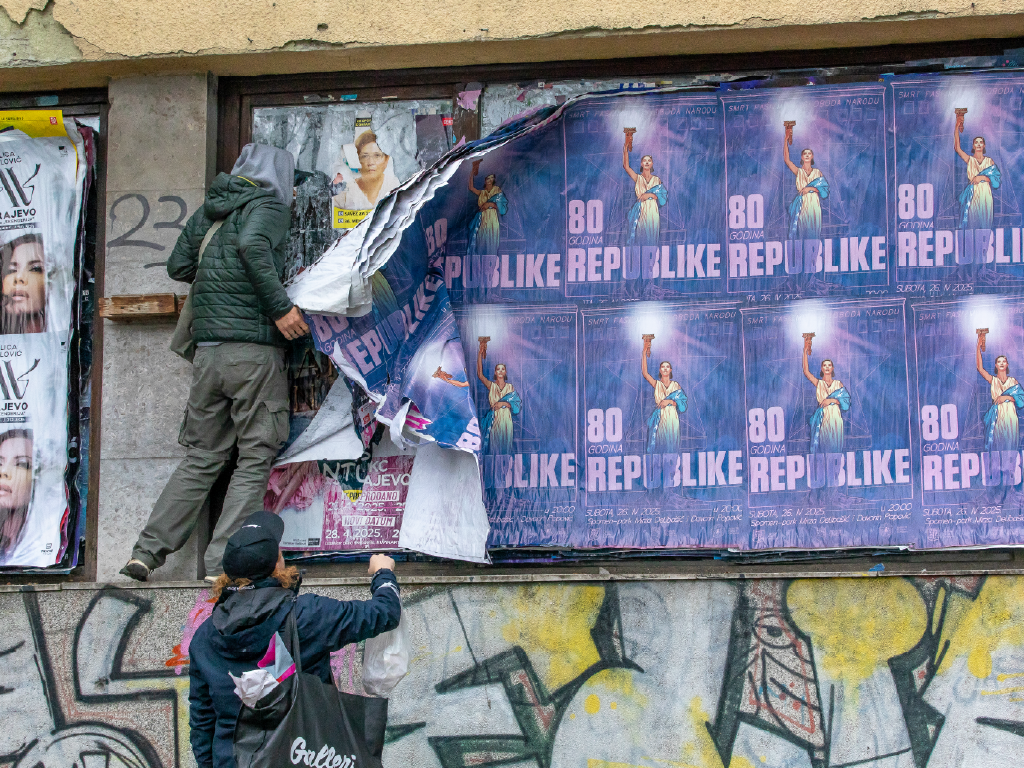 René Konings collecting posters in Sarajevo, Bosnia and Herzegovina.