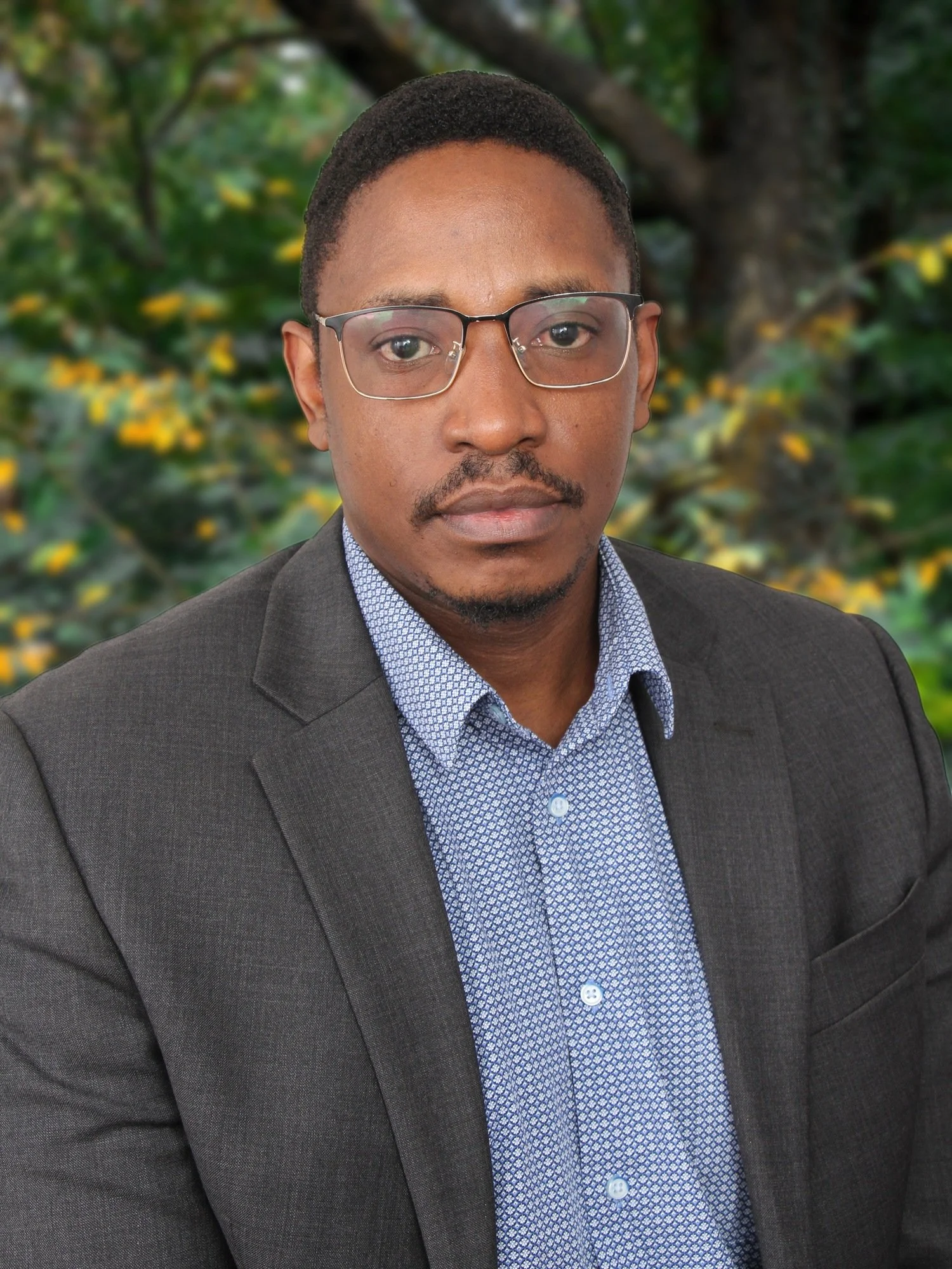Man wearing grey shirt suit with blue shirt