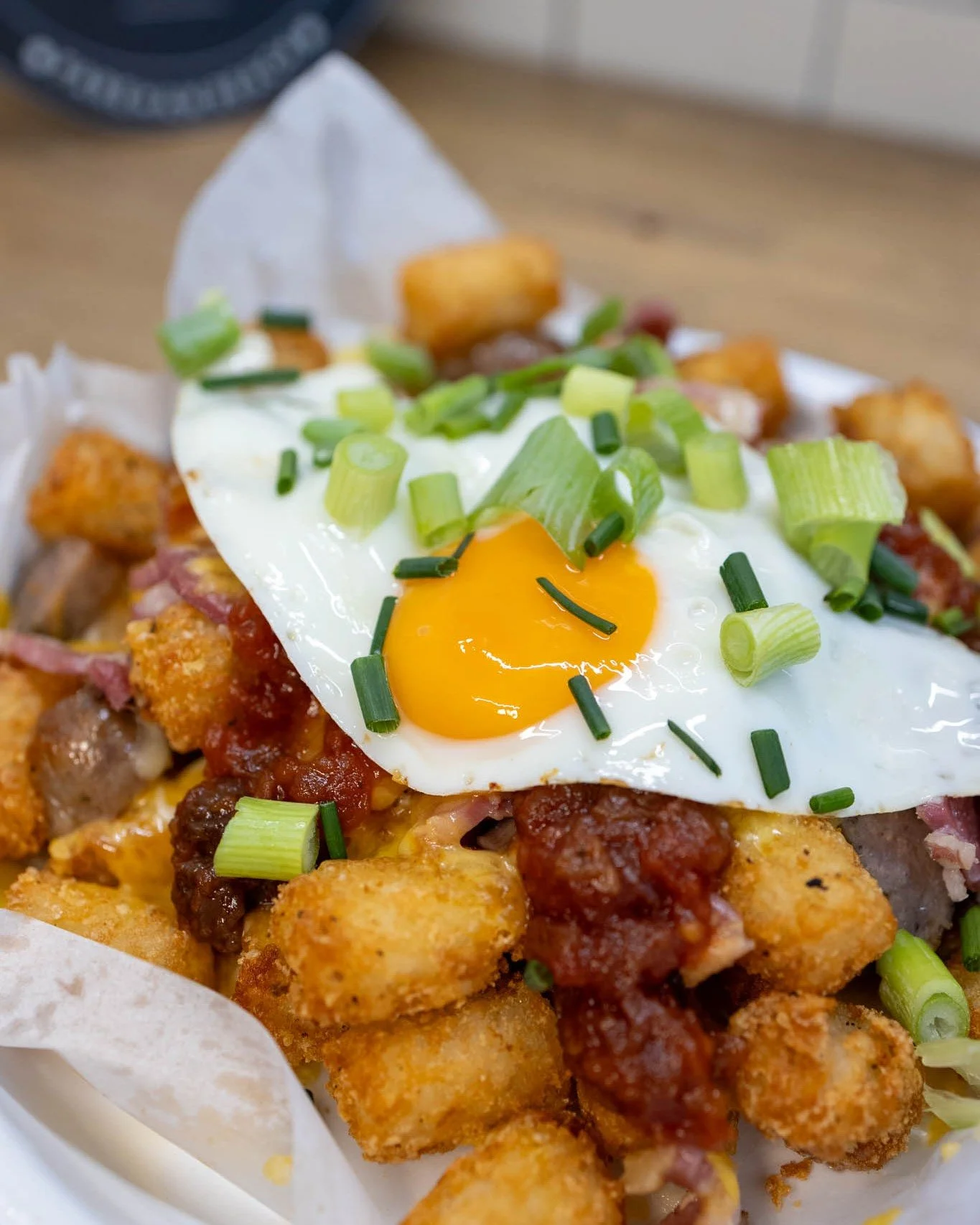 Have you tried our Breakfast Tots? It's quite simple really...a big portion of tots, with a load of breakfast items chucked on top for good measure...See how we came up with that name? Bit like Ronseal, does exactly what it says on the tin...