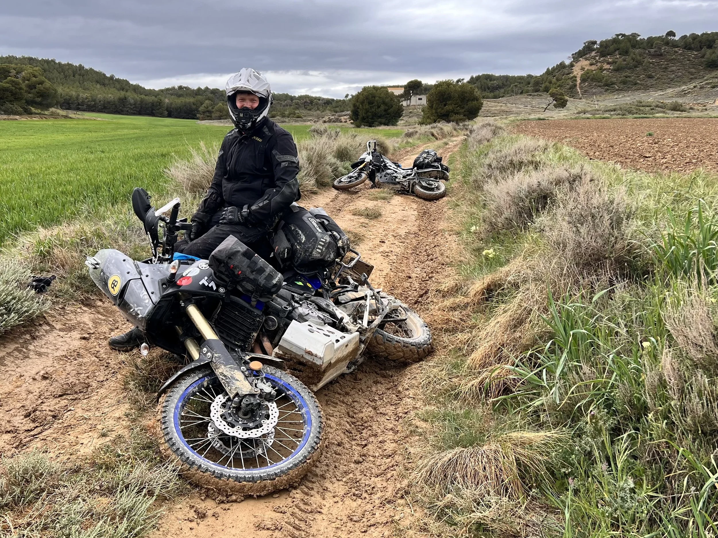 Tired motorcycles resting in the mud in Spain