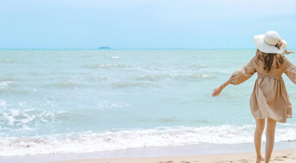 Woman walking the uncrowded shoreline on North Captiva Island, Florida