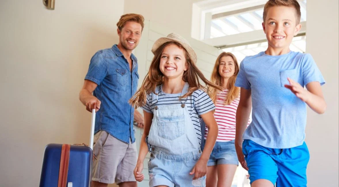 Family with luggage arriving at a family-friendly North Captiva Island vacation home