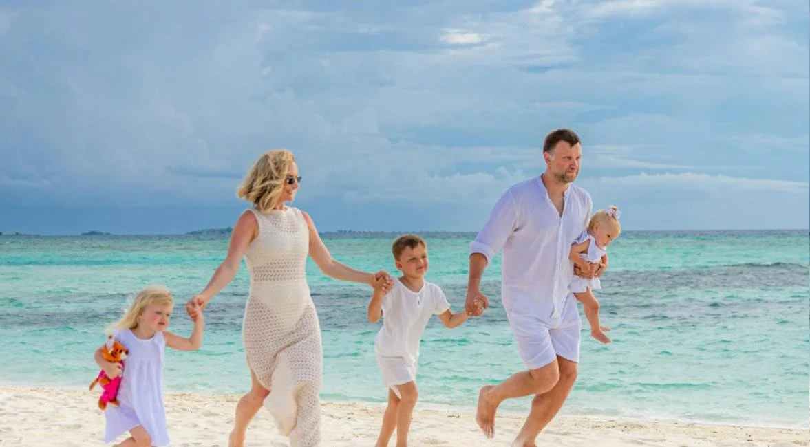 Multigenerational family walking the beach on North Captiva Island, Florida