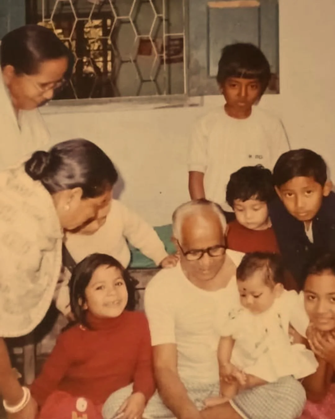 Digging into the family album is one thing. Posting it on the internet? Whole different nerve. But since Golpo is about stories, here I am baring it all, vintage-photo style.

অন্নপ্রাশন (Annoprashon). my first bite of solid food (rice, of course), w