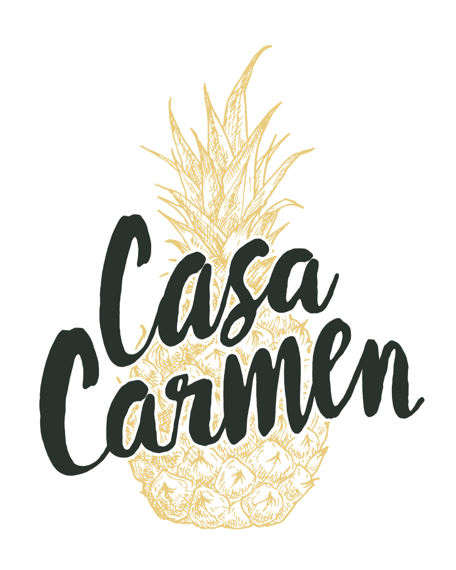 A stylized illustration of a pineapple with the words "Casa Carden" written across it in black script.
