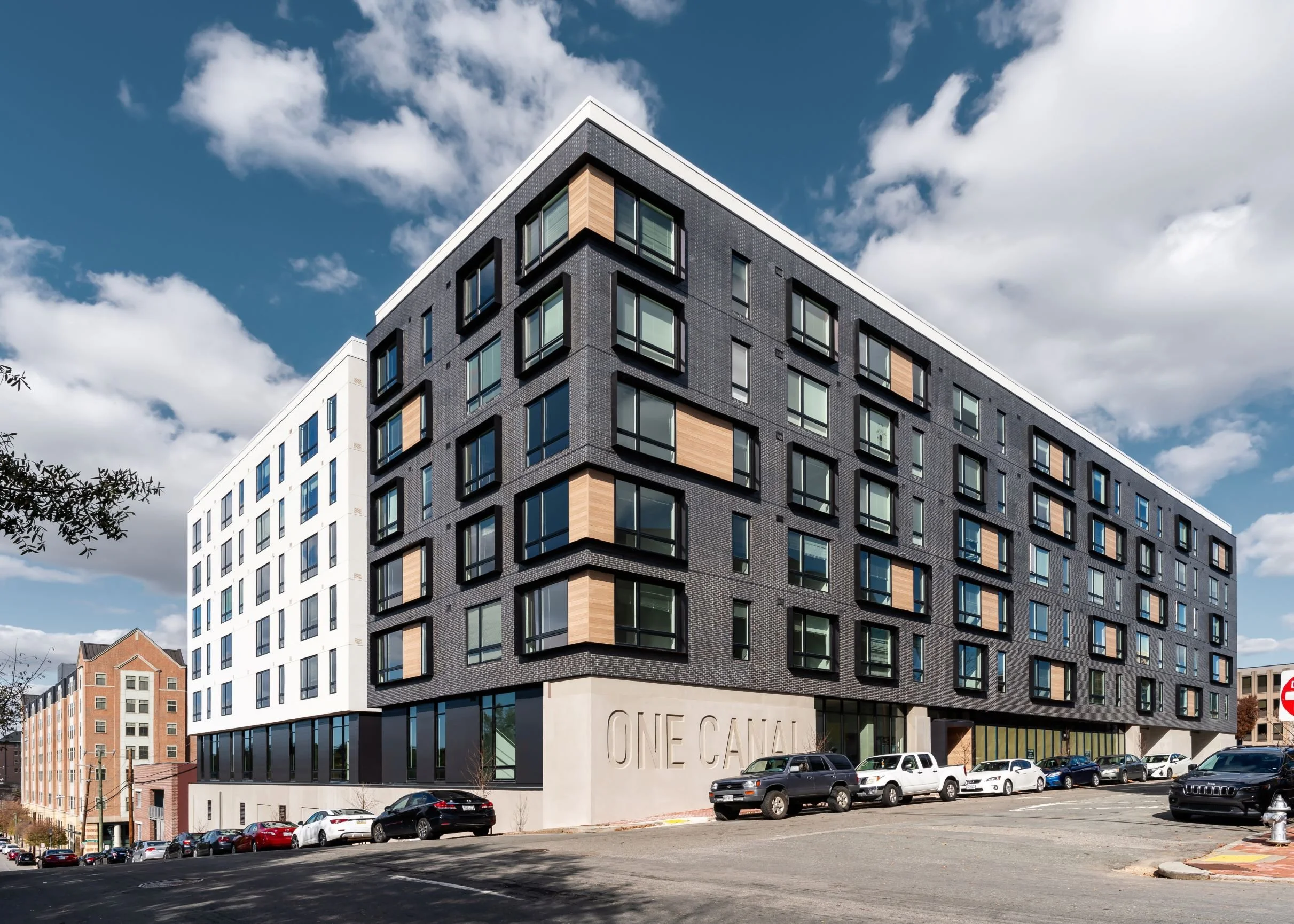 Exterior shot of SMBW mixed-use development One Canal on the corner of First and Canal in the Monroe Ward neighborhood