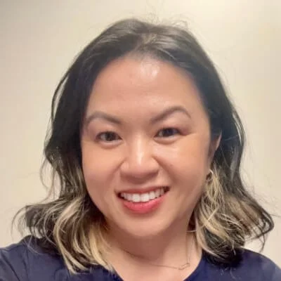Christina is a Vietnamese-American woman with long highlighted hair