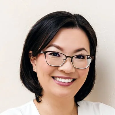 Angela Tam is a Taiwanese woman wearing glasses