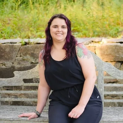 Rosie sitting on a bench