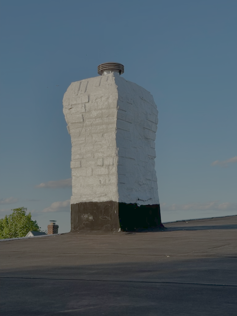 Chimney painted to resemble a torso, with a black bottom, on a flat rooftop under a blue sky