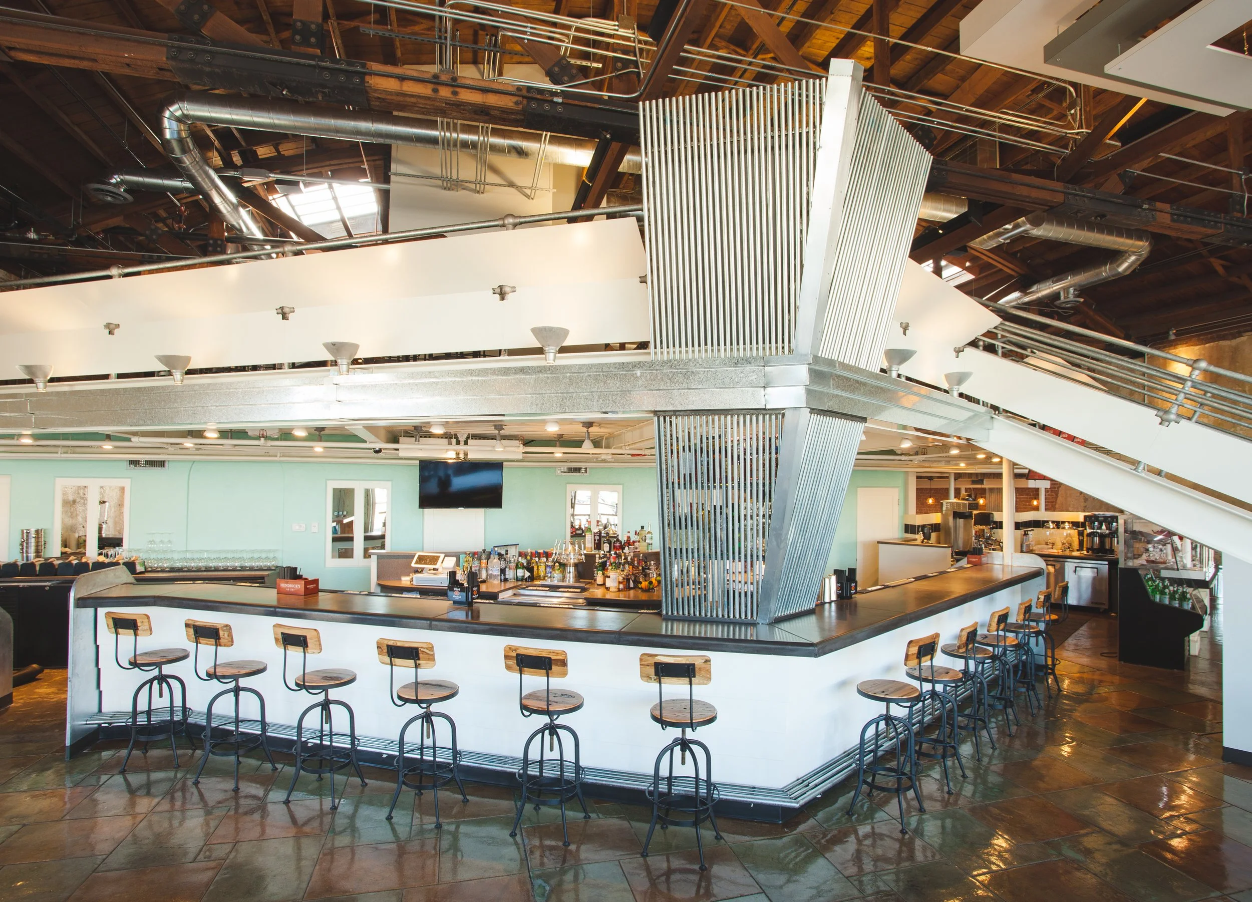 DeSoto Central Market custom bar design Phoenix - automotive inspired interior historic car dealership adaptive reuse