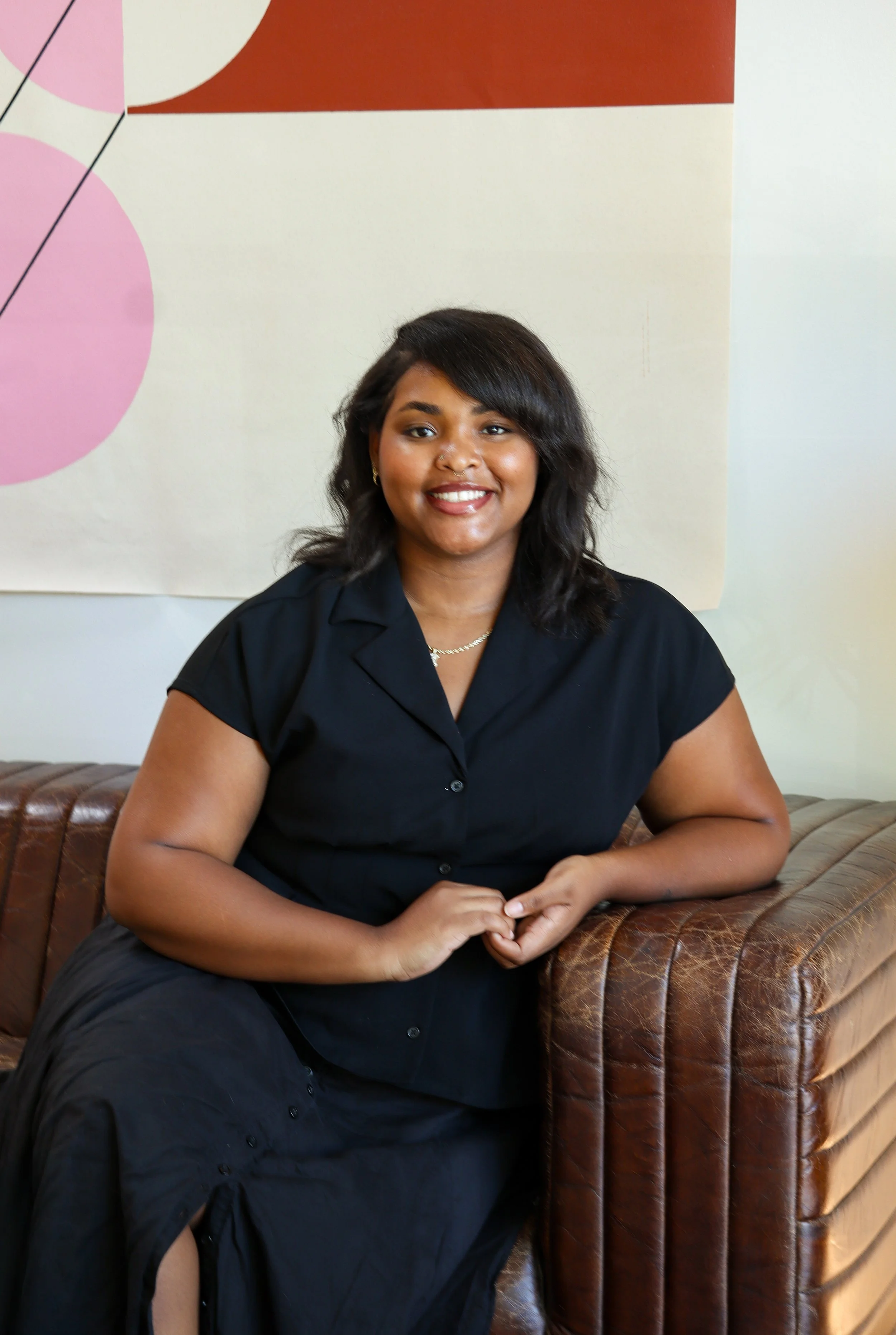 interior Design studio assistant sitting on channel tufted sofa