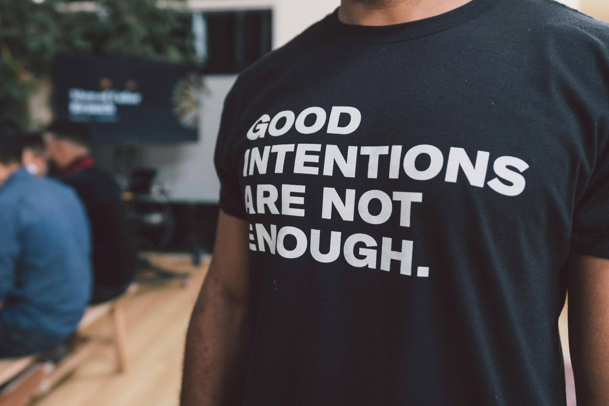 Edgar Chaparro: A black shirt with white text that reads: "GOOD INTENTIONS ARE NOT ENOUGH."