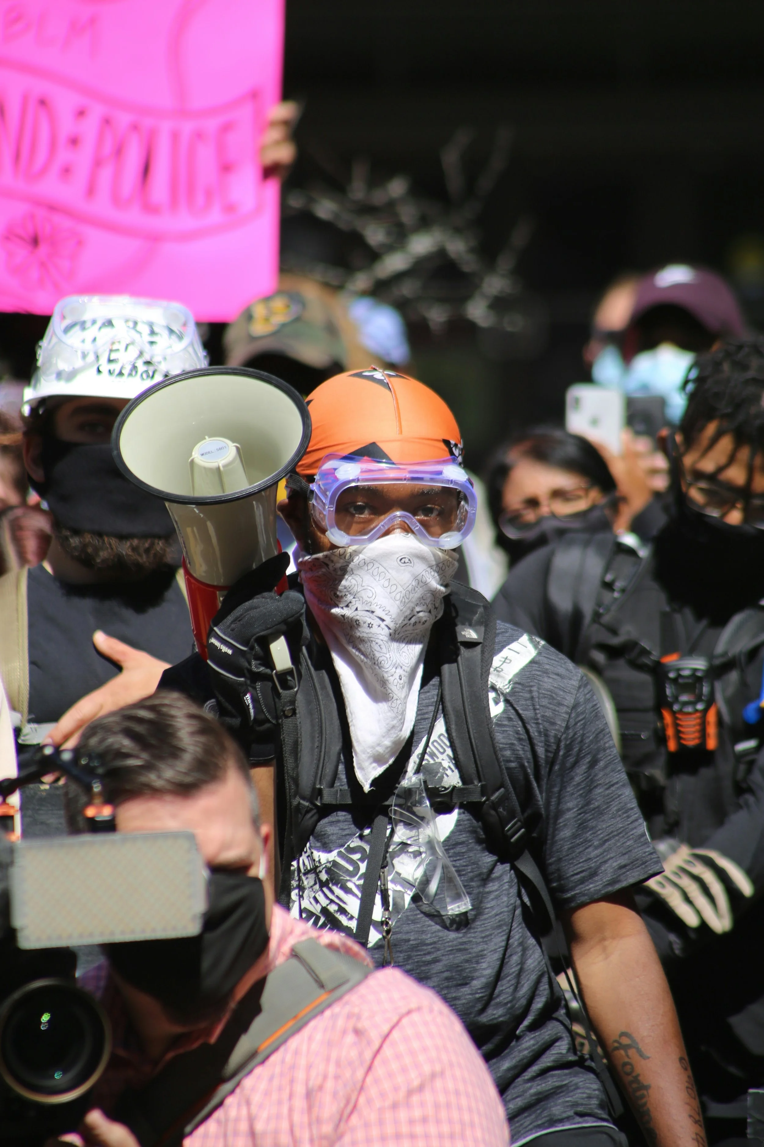 Man in a protest wearing goggles
