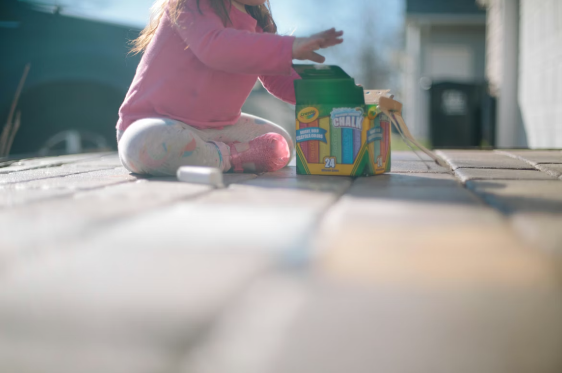 Toddler opening chalk box