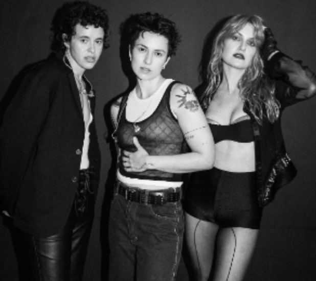 A photo of three people, looking at the camera