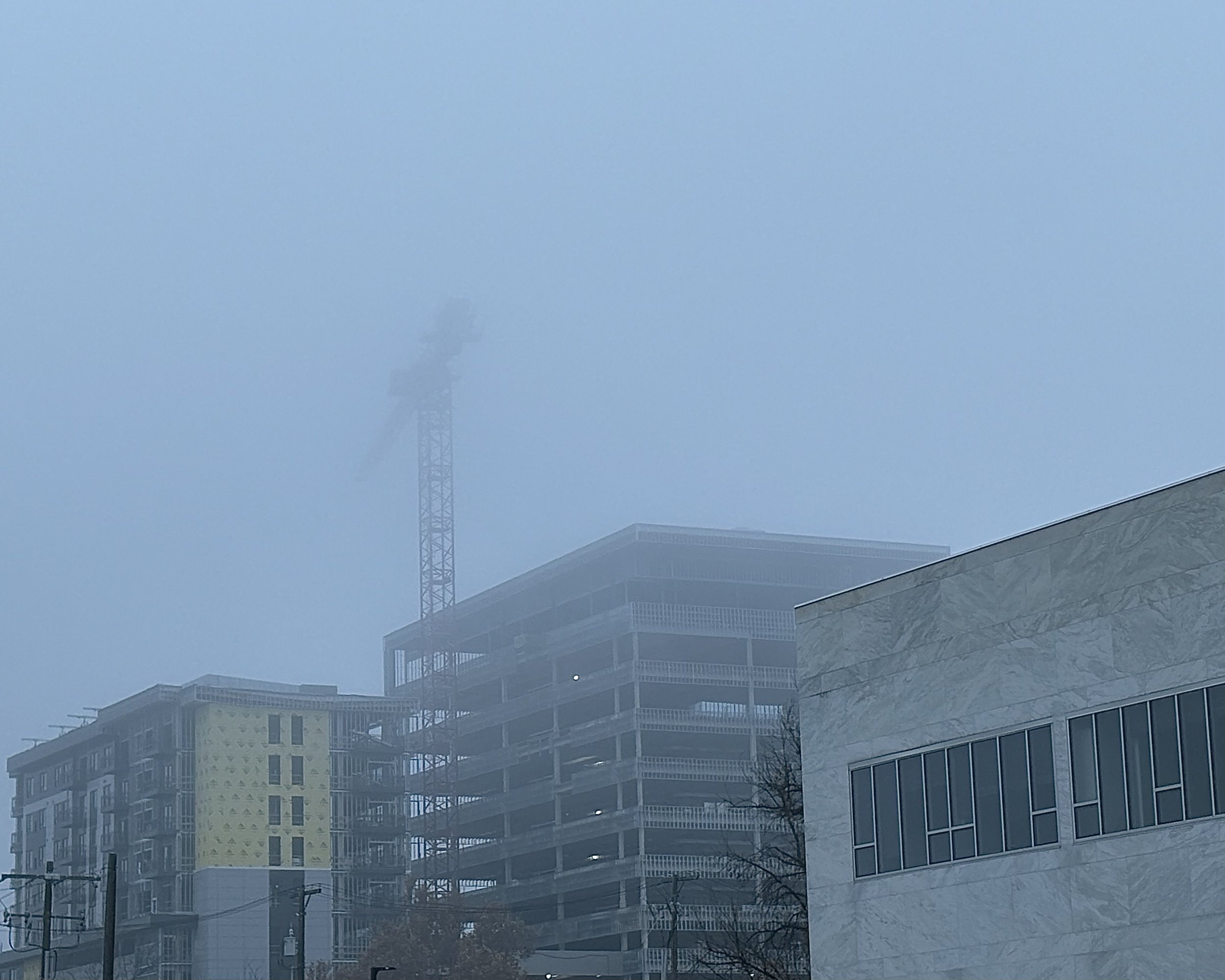 three buildings in fog