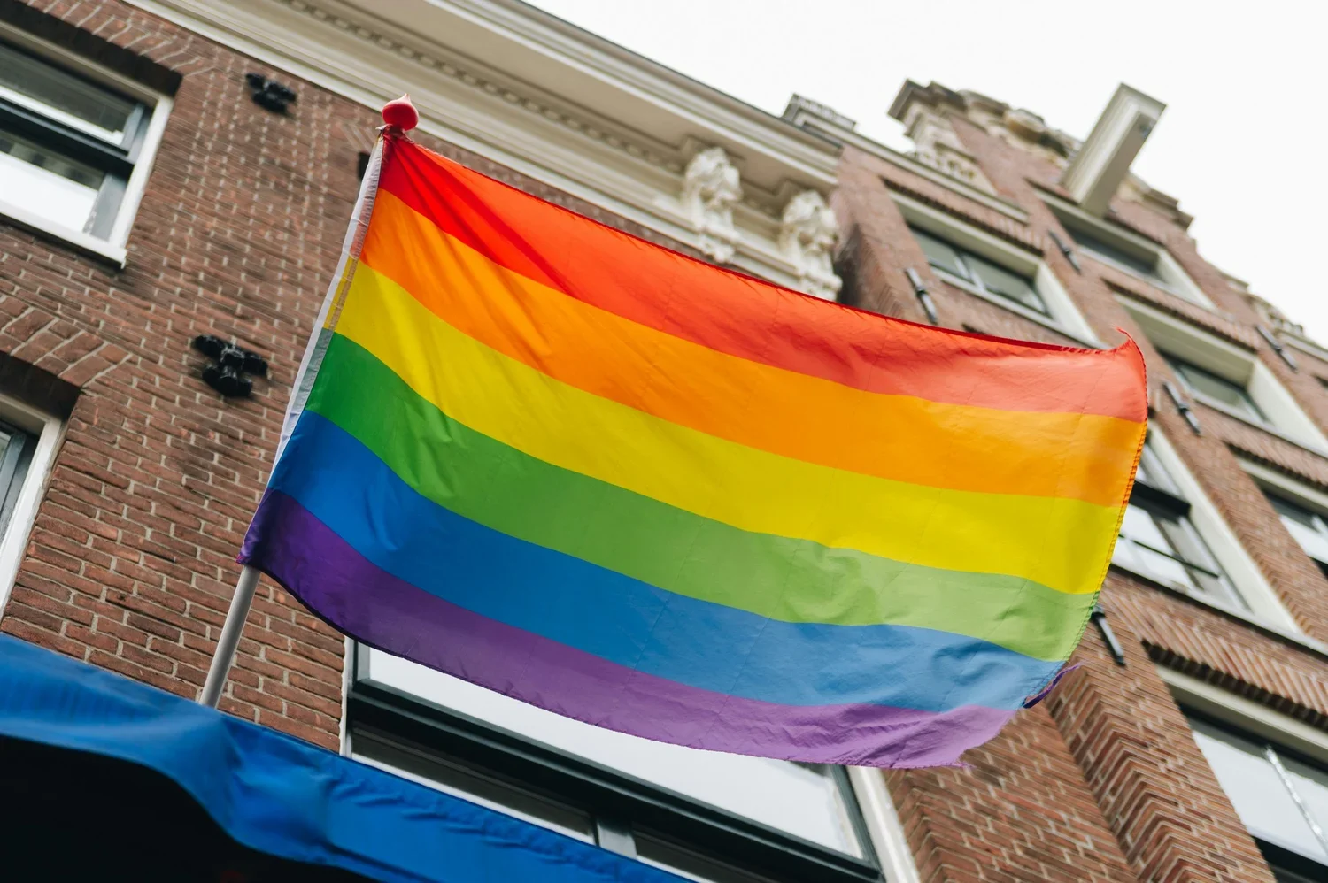 A pride flag waving in the wind