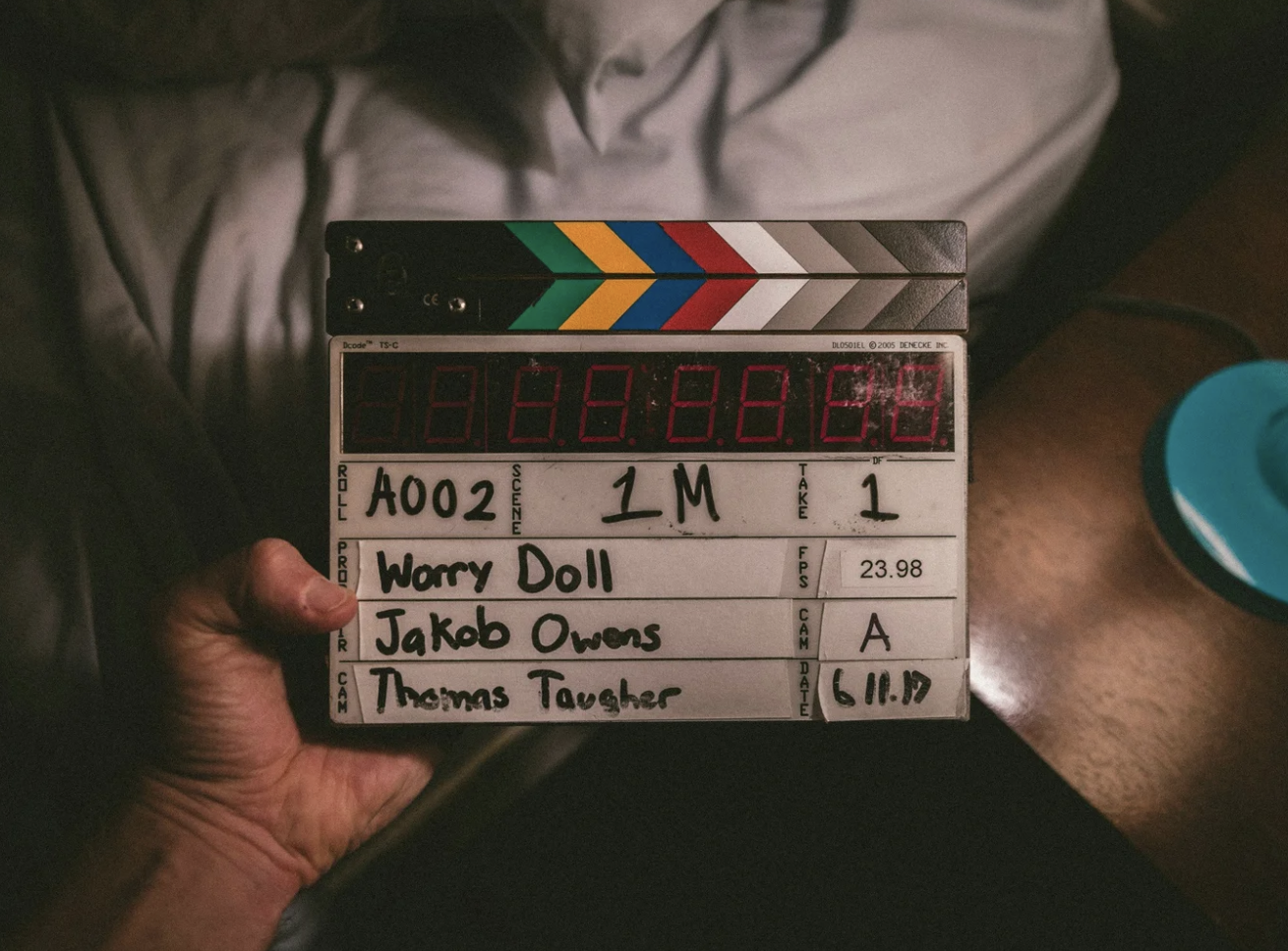 A photo of a clapperboard for a production of Worry Doll