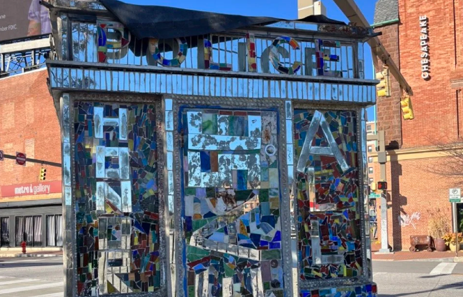 a mosaic sculpture covered in thousands of tiny mirrors