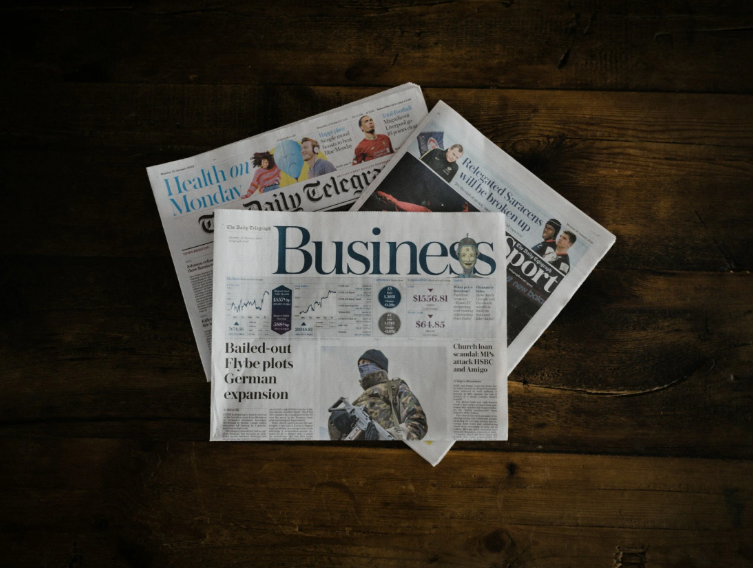 newspapers stacked on top of one another