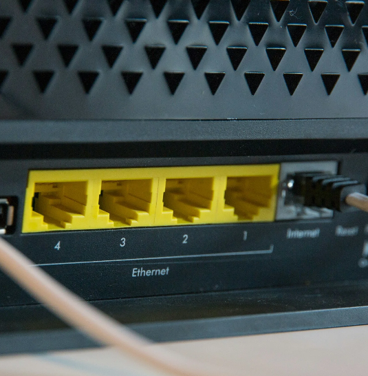 The back of an internet box showing empty ethernet plug-ins.