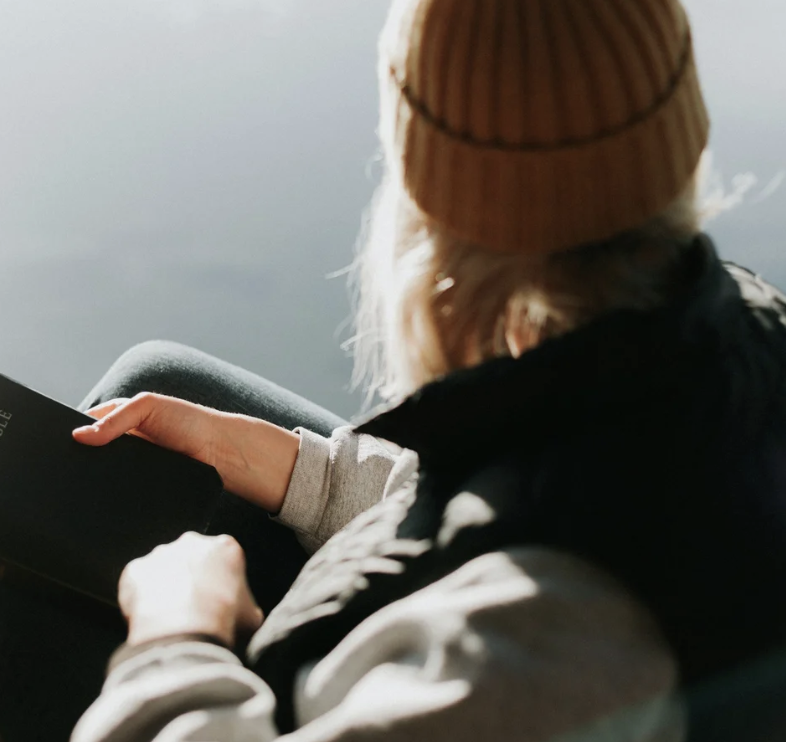 A photo of someone sitting, looking to the right