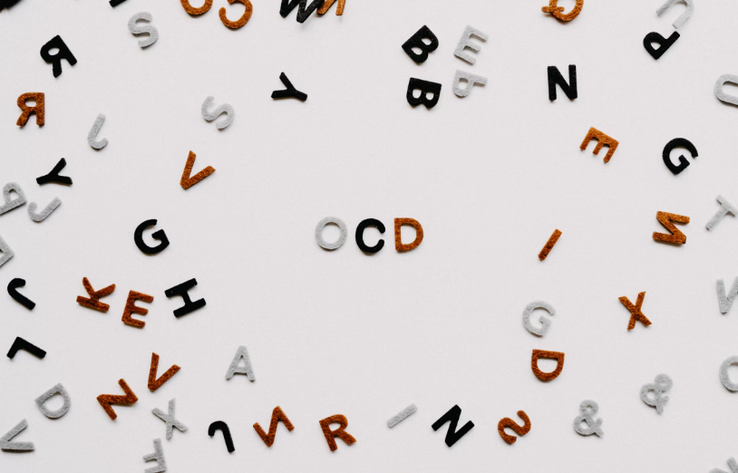 alphabet letters scattered, spelling out "OCD"