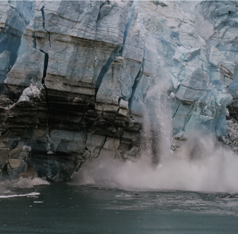 A photo of a rock dropping into the ocean.