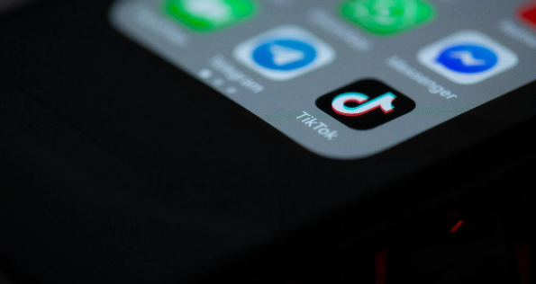A close-up of a phone screen, with TikTok being clearly visible.