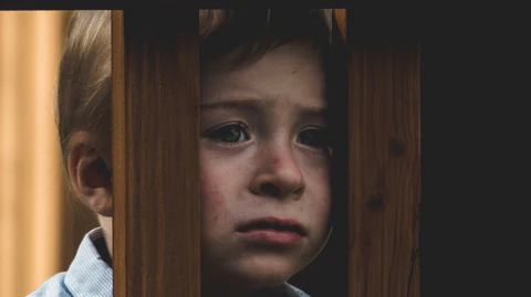 A boy's face in the door