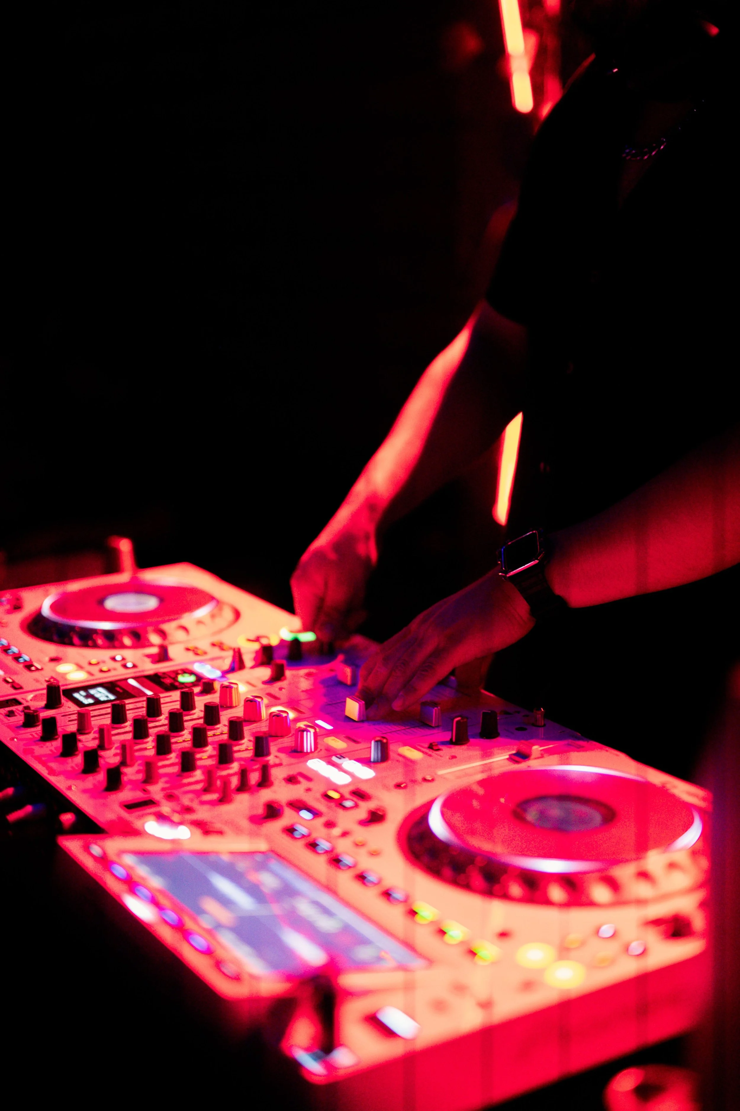 Image of someone DJing at a club