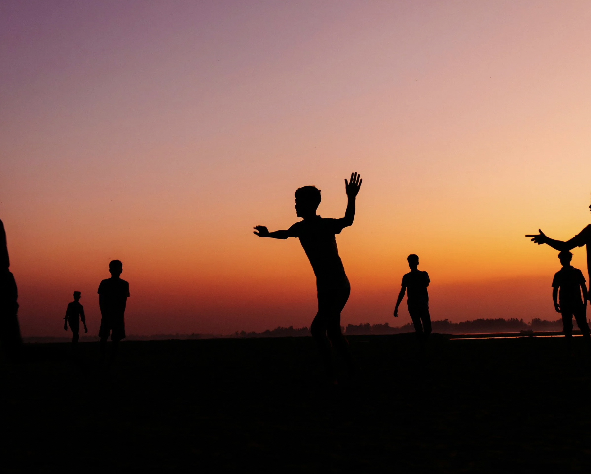 boy running in the sunset