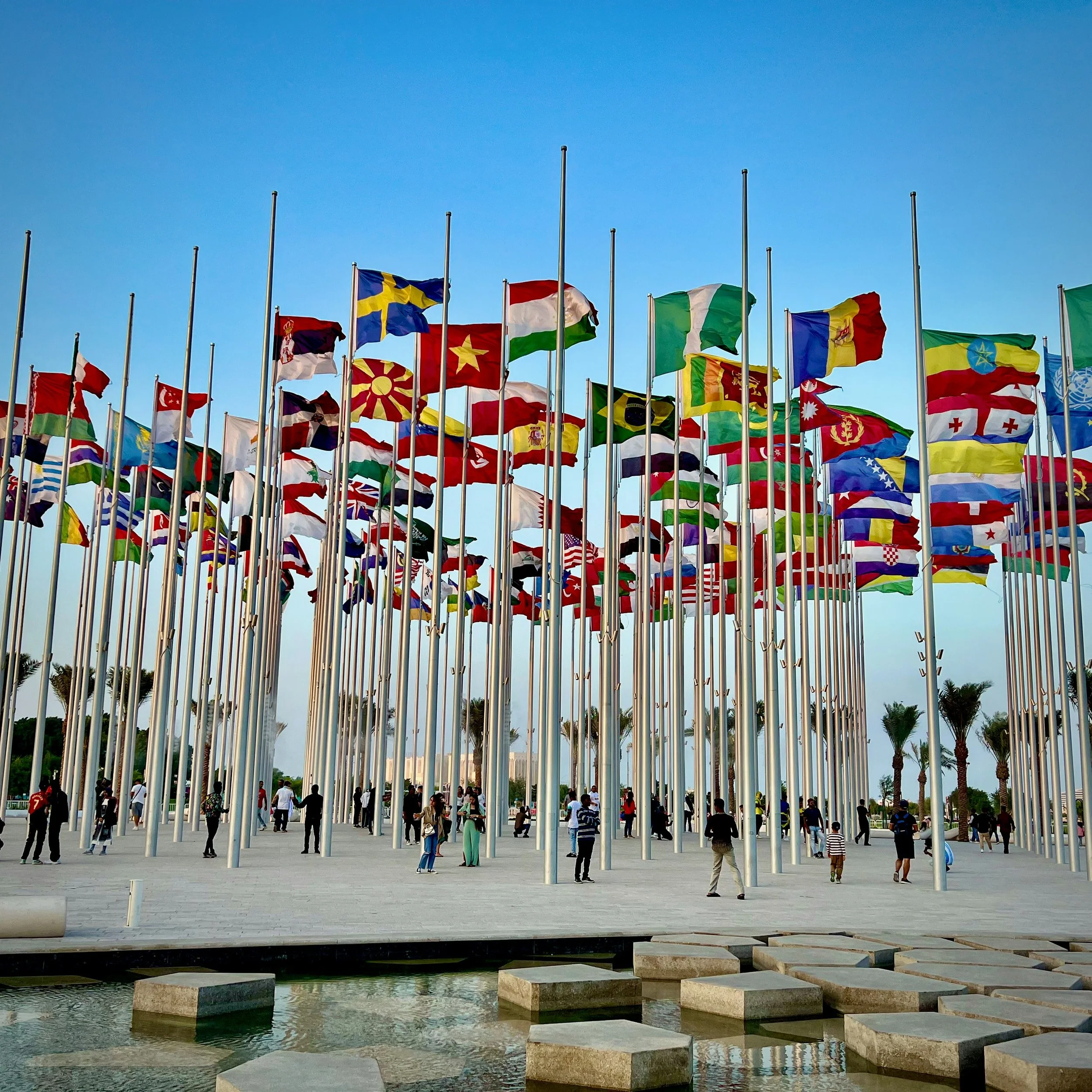 A picture of a boardwalk with many different countries flags 