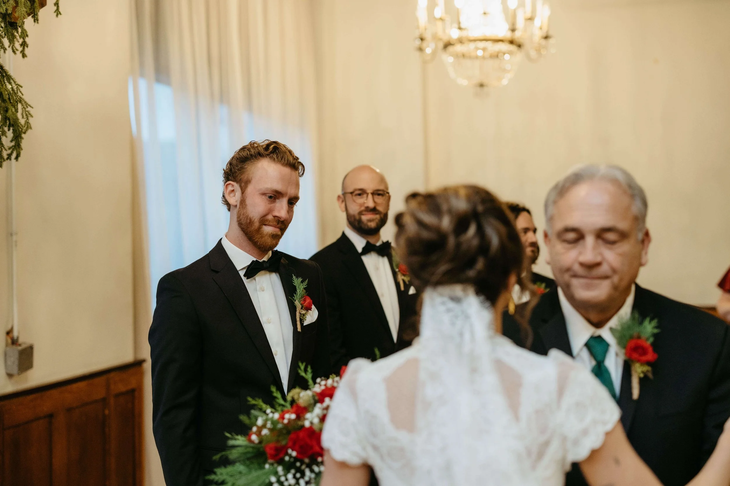 Groom looking at his bride emotionally as she walks down the aisle to him during their ceremony at the Icon.