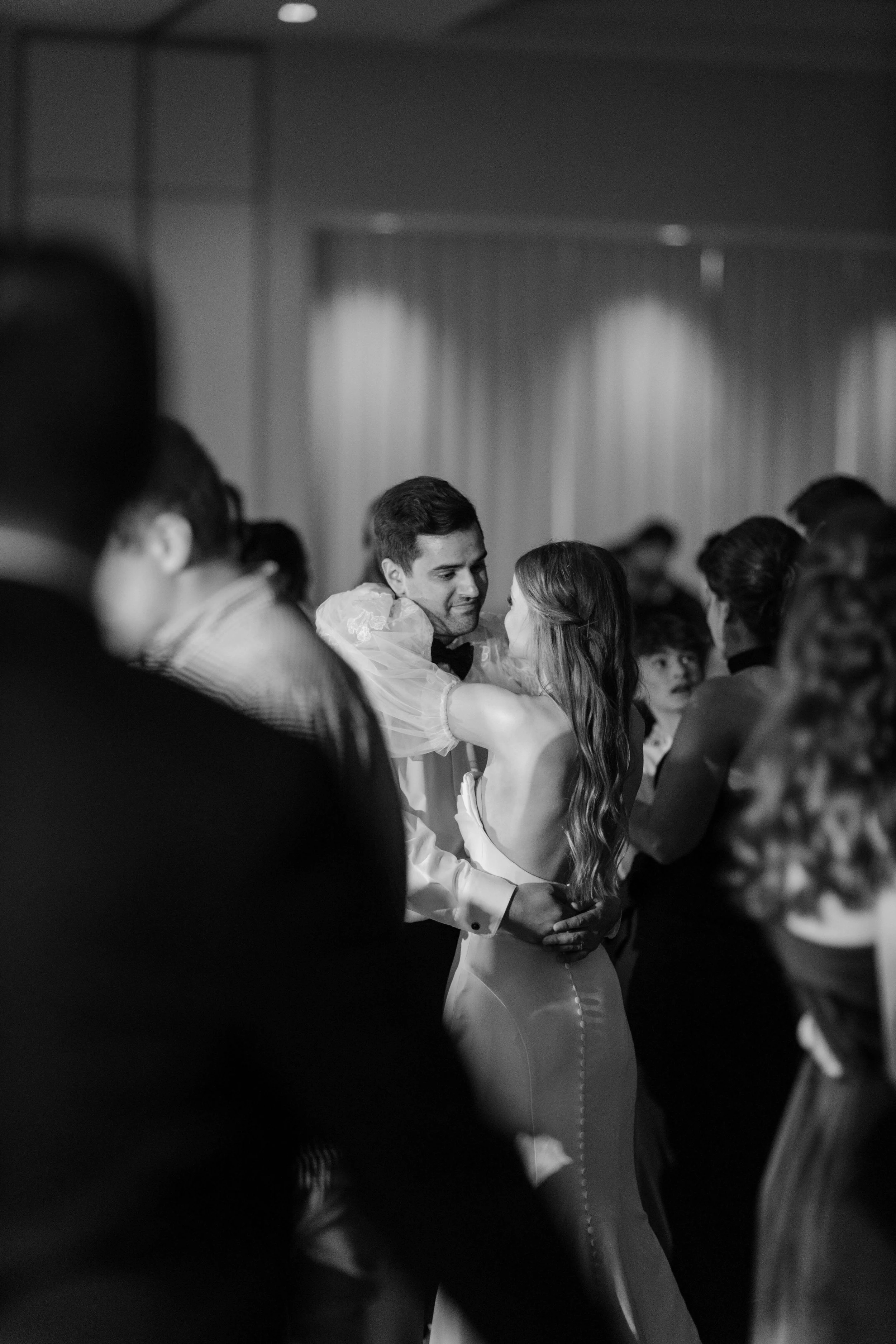 Couple dancing during their reception at downtown hotel to a live band. Photos taken by Jenna Heckel photography.