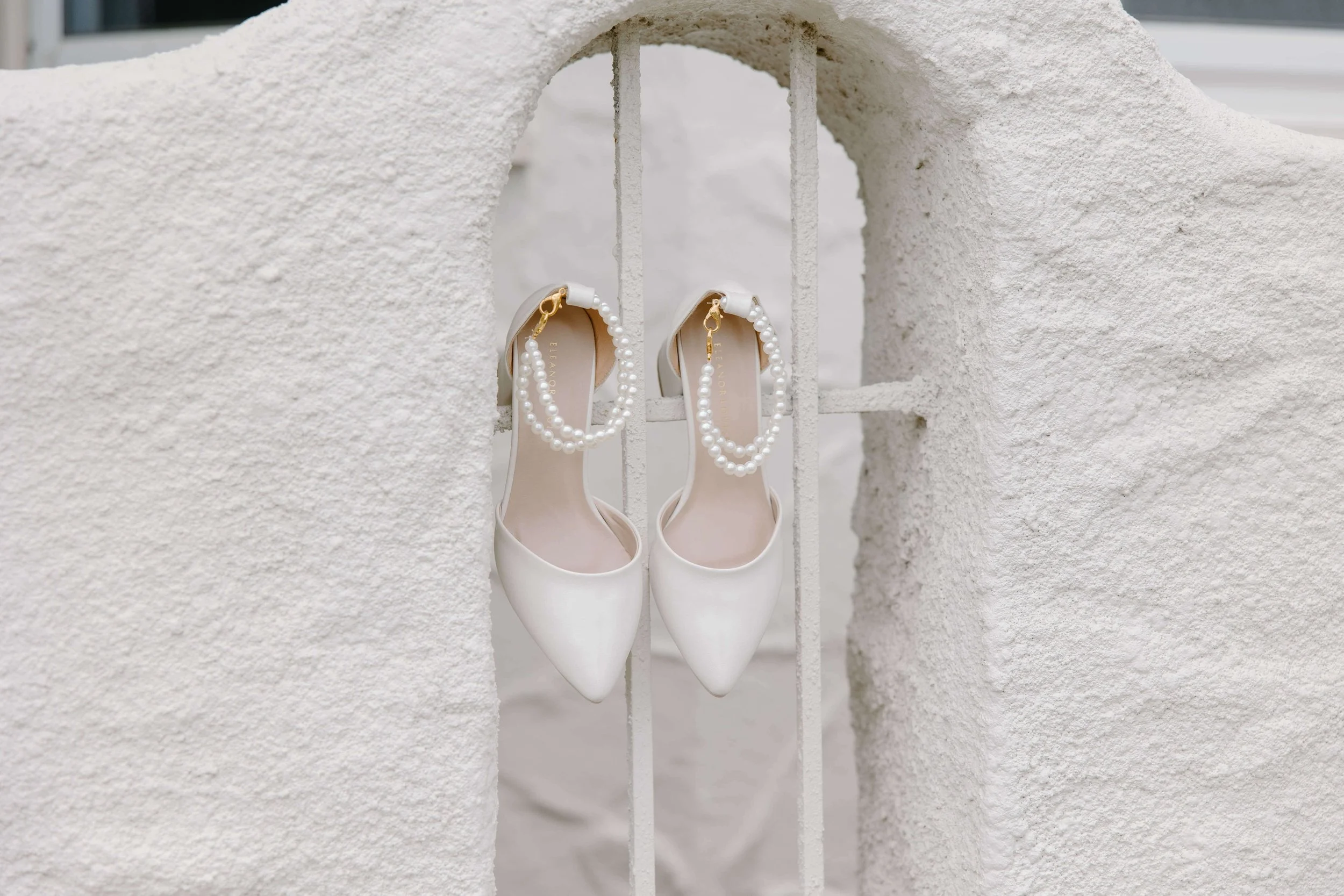 Fun photo of brides shoes at her airbnb in Sioux Falls, photographed by Jenna Heckel.