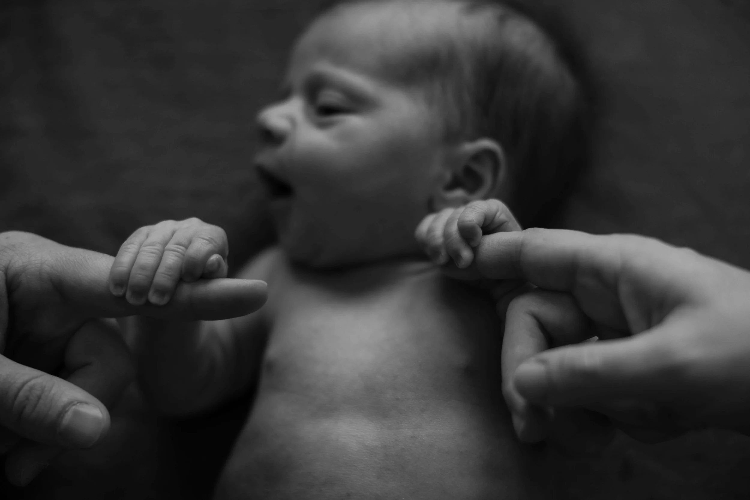 In home lifestyle newborn family photos in downtown Sioux Falls.