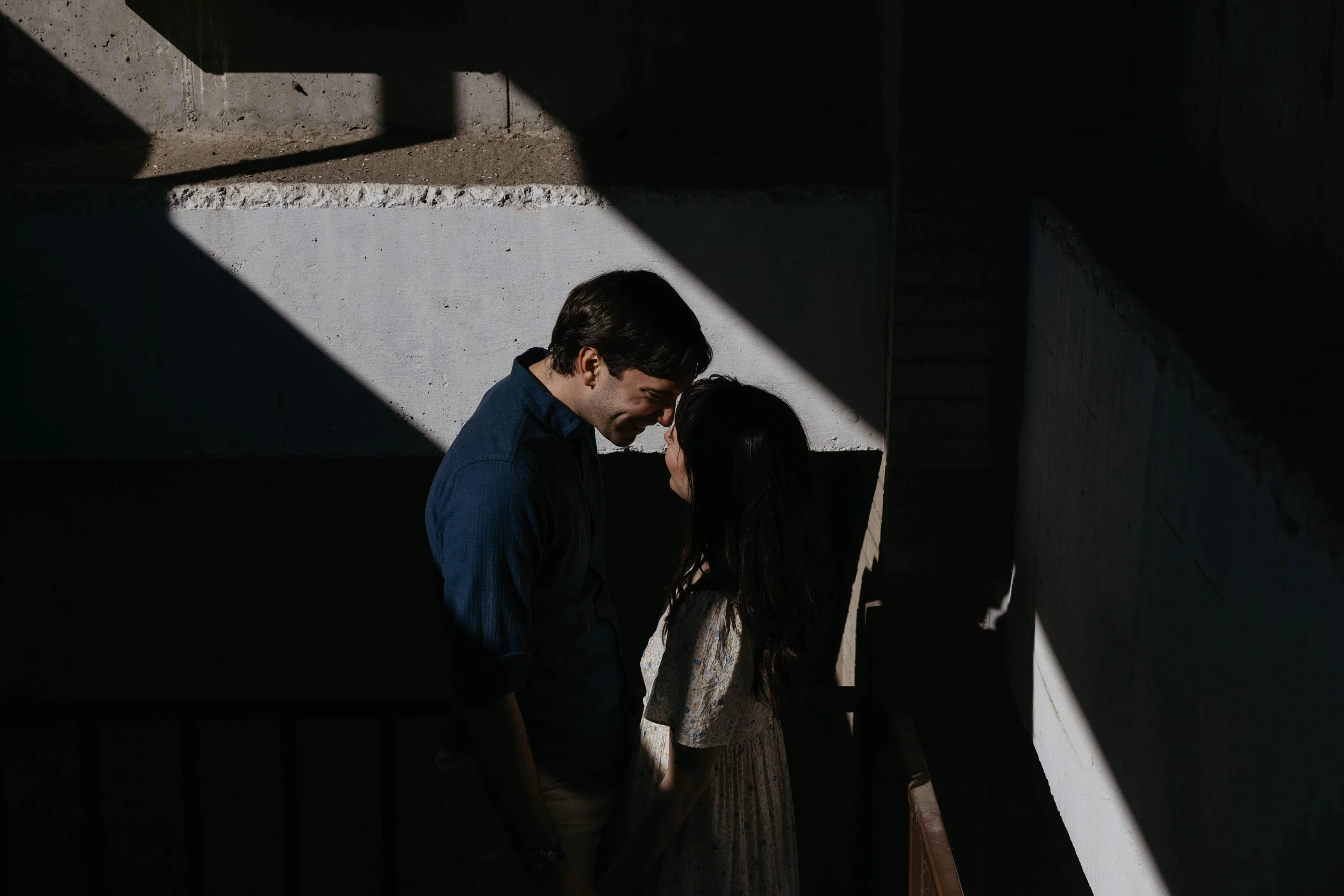 A couple embracing during an engagement photography session in Sioux Falls
