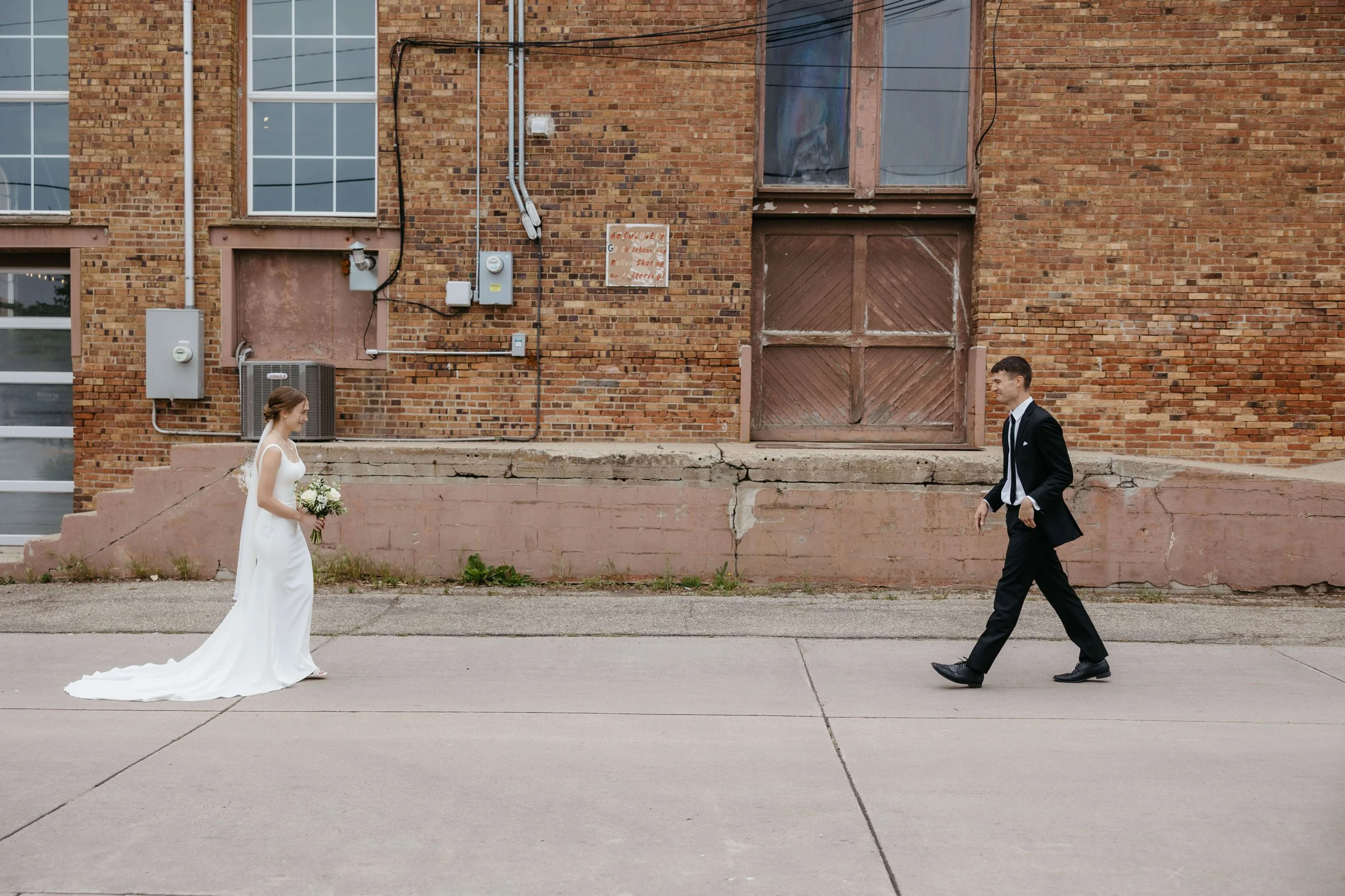 Couple on their wedding day seeing each other for the first time during their first look. Photographed by Jenna Heckel in Yankton South Dakota