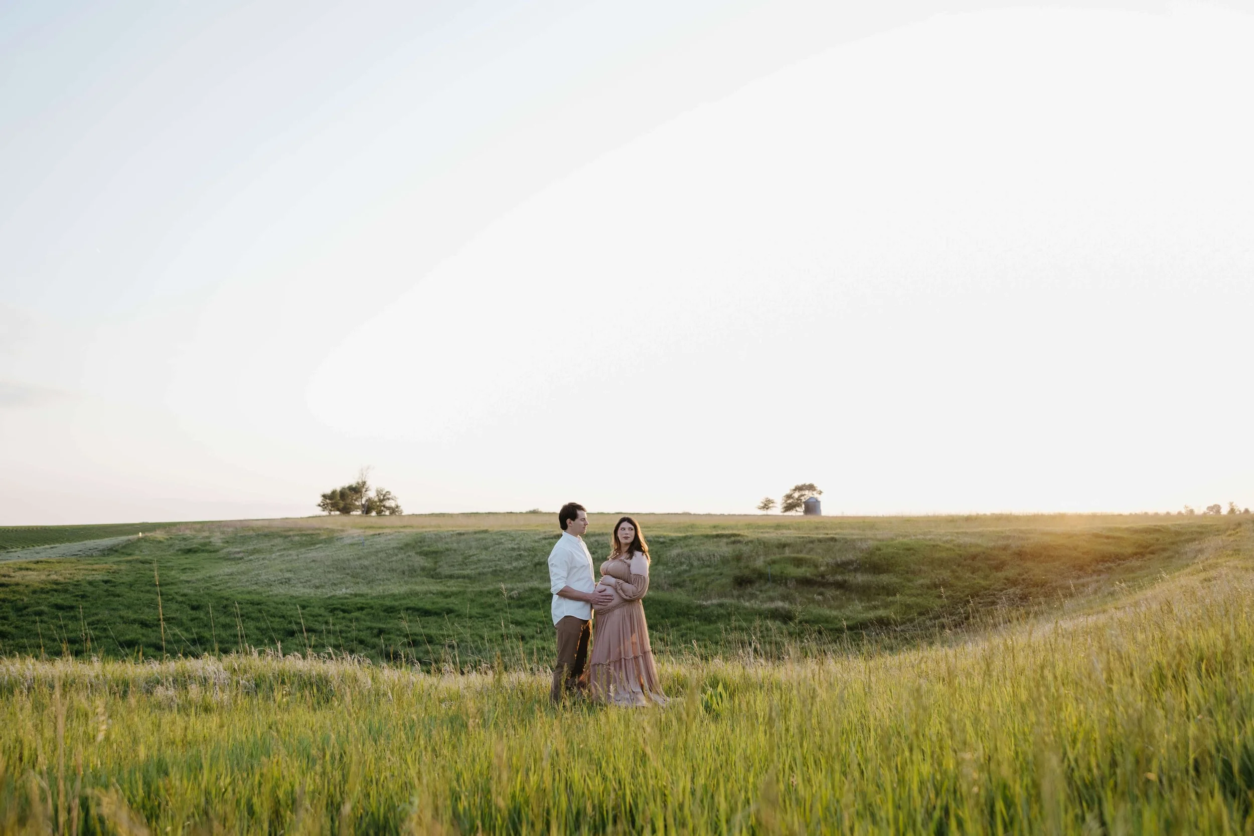Couple doing maternity photos at Good Earth State Park near Sioux Falls, South Dakota. Photographed by Jenna Heckel Photography.
