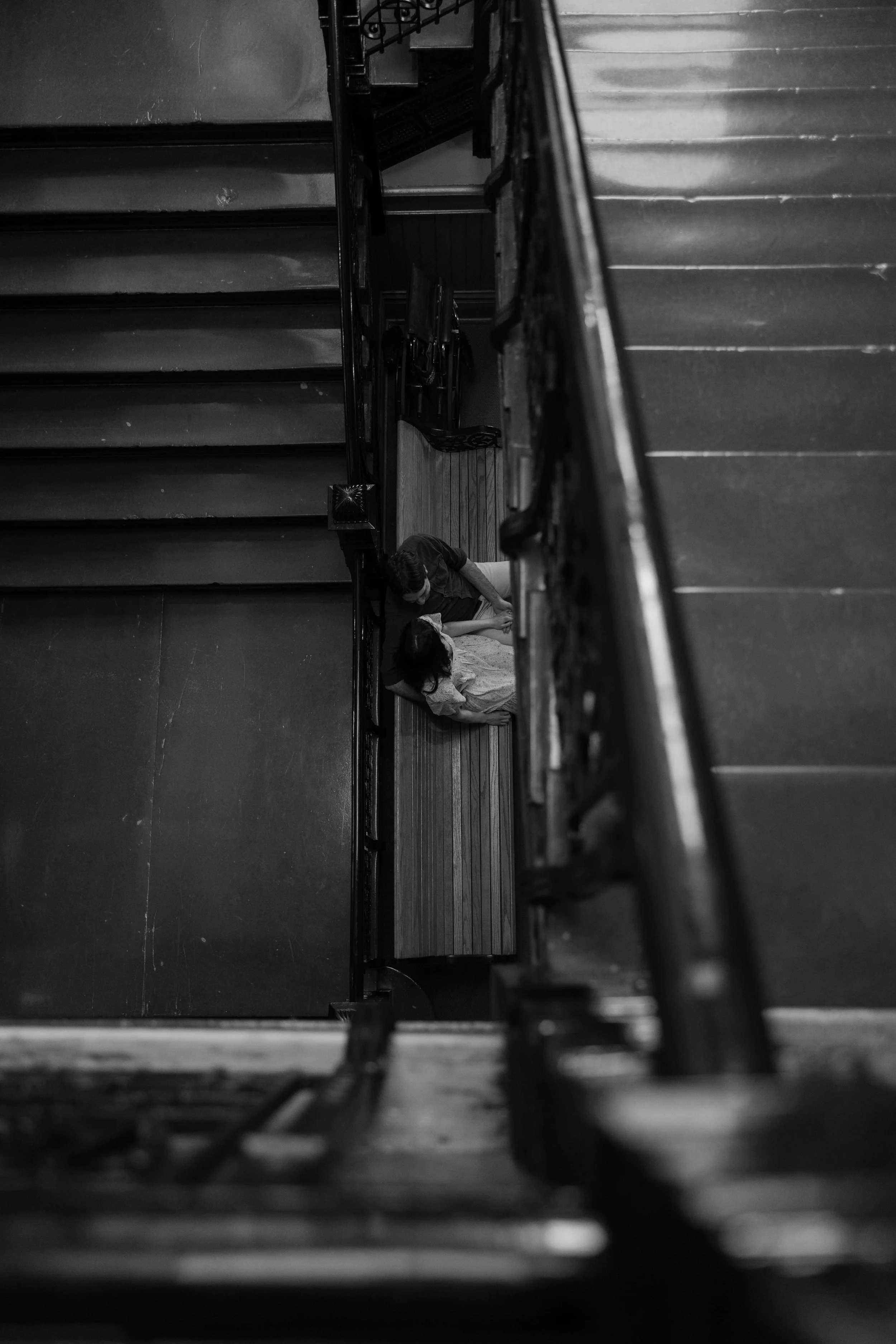 Engaged couple walking hand in hand at the Old Courthouse Museum in downtown Sioux Falls. Photographed by Jenna Heckel photography.