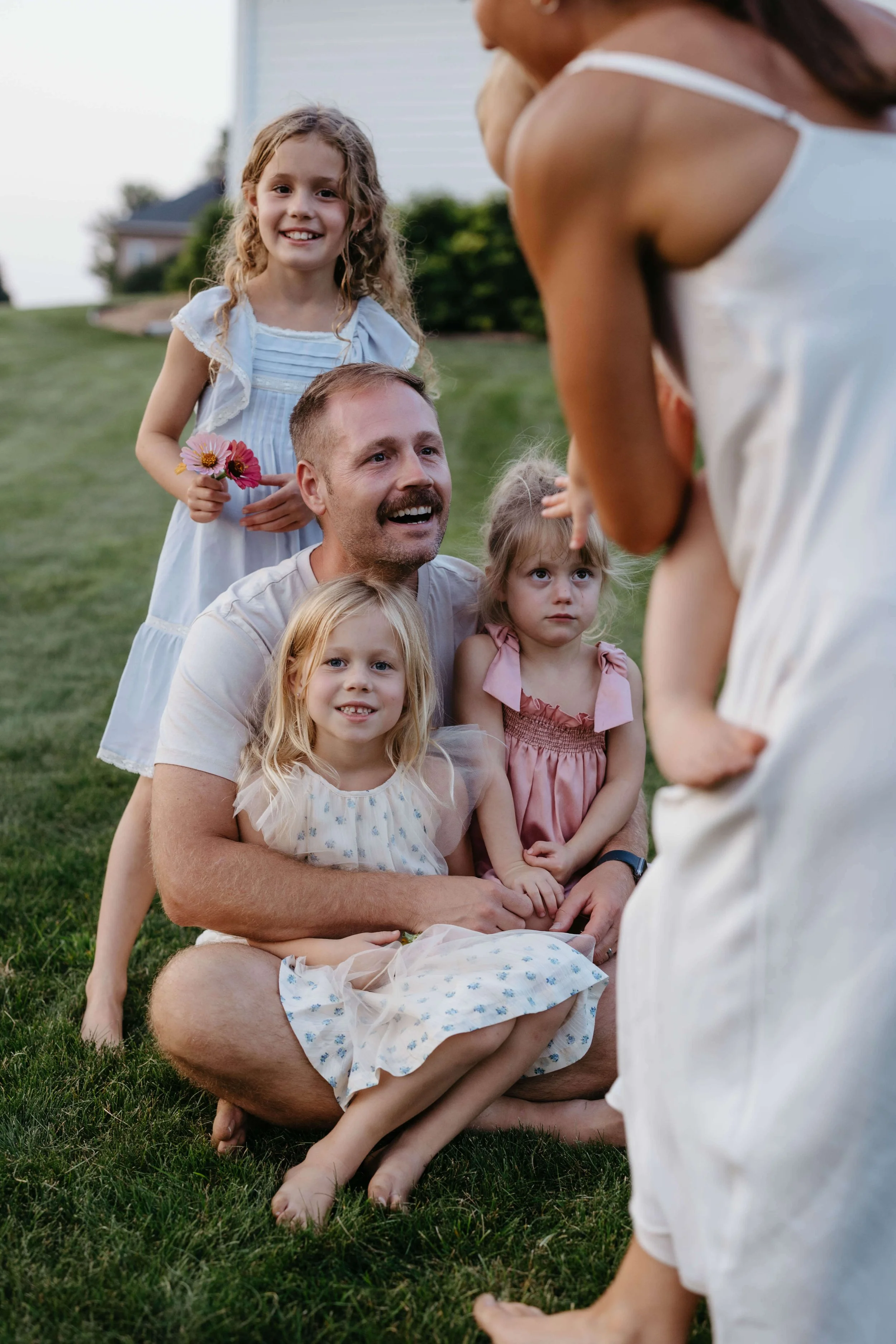 Father and daughters during family photo session near Brandon South Dakota. Photographed by Jenna Heckel Photography.