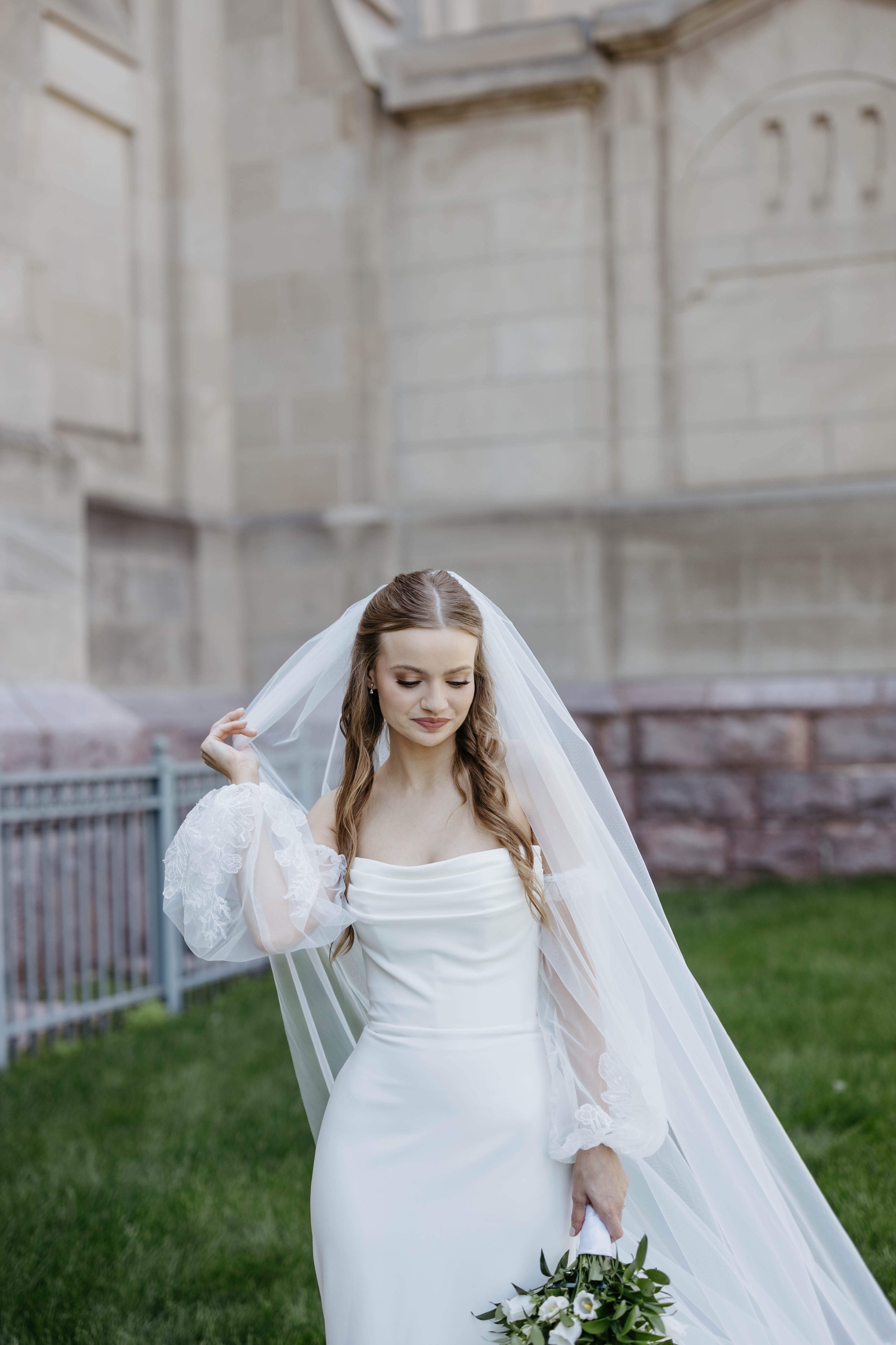 Bride on her wedding day at St. Josephs Cathedral in the historic district of downtown Sioux Falls South Dakota.