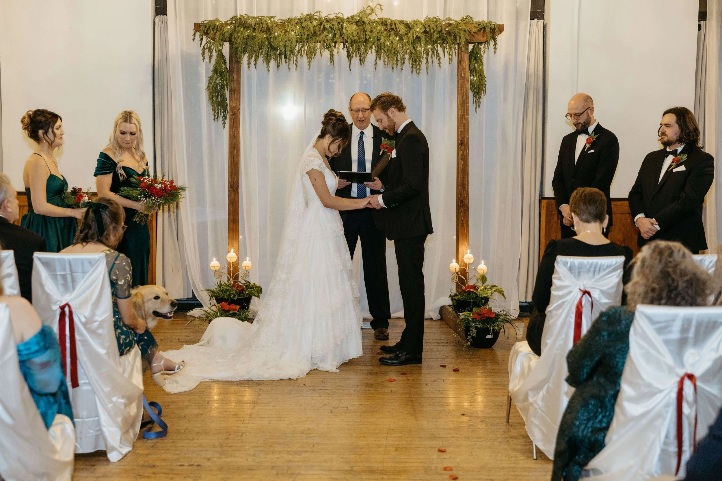 Bride and groom praying during their micro wedding at the Icon in downtown Sioux Falls. Photographed by Jenna Heckel a Sioux Falls photographer. 