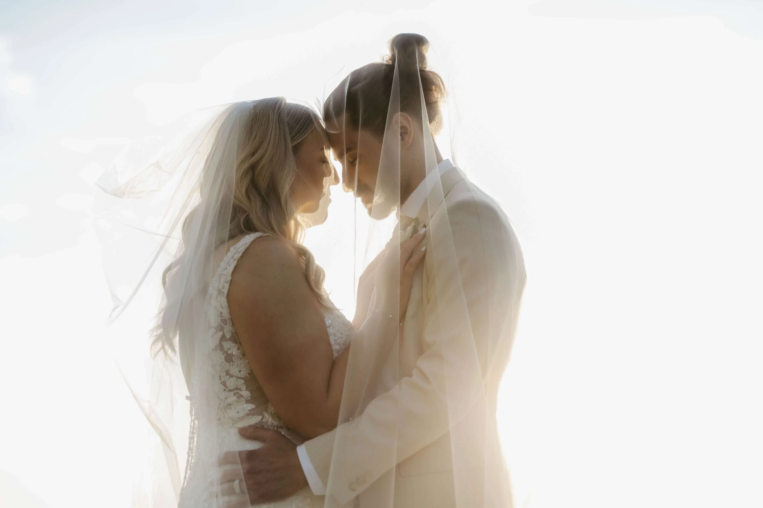 Bride and groom doing sunset portraits at the Canton Barn in Canton South Dakota, photographed by Jenna Heckel Photography. 